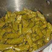 Dolmathakia: Stuffed grape leaves with beef, pork, and rice, ready to cook