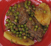 Beef stew with peas and potatoes in a tomato sauce