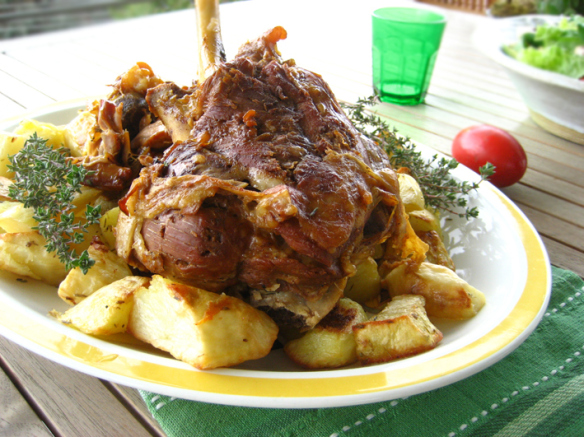 Pot roasted leg of lamb with garlic and cheese